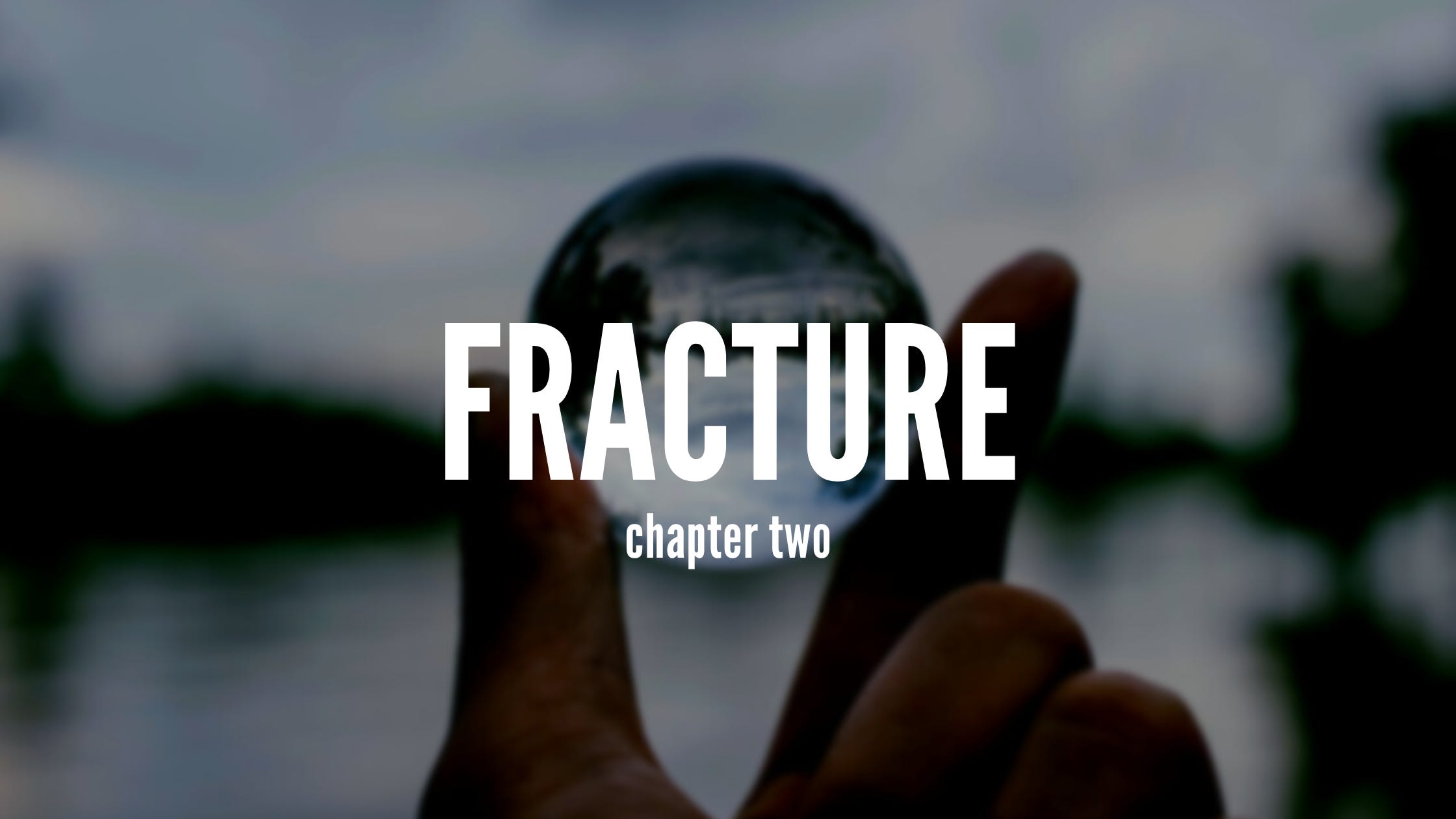 Cover image. Text overlaying a picture of a hand holding a small glass ball. Text reads 'Fracture chapter two'